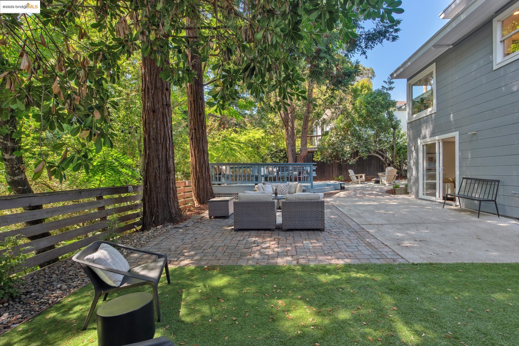 4479 Elinora Avenue Oakland, CA 94619 - Photo 39 of 47 Fenced backyard with a patio and an outdoor living space
