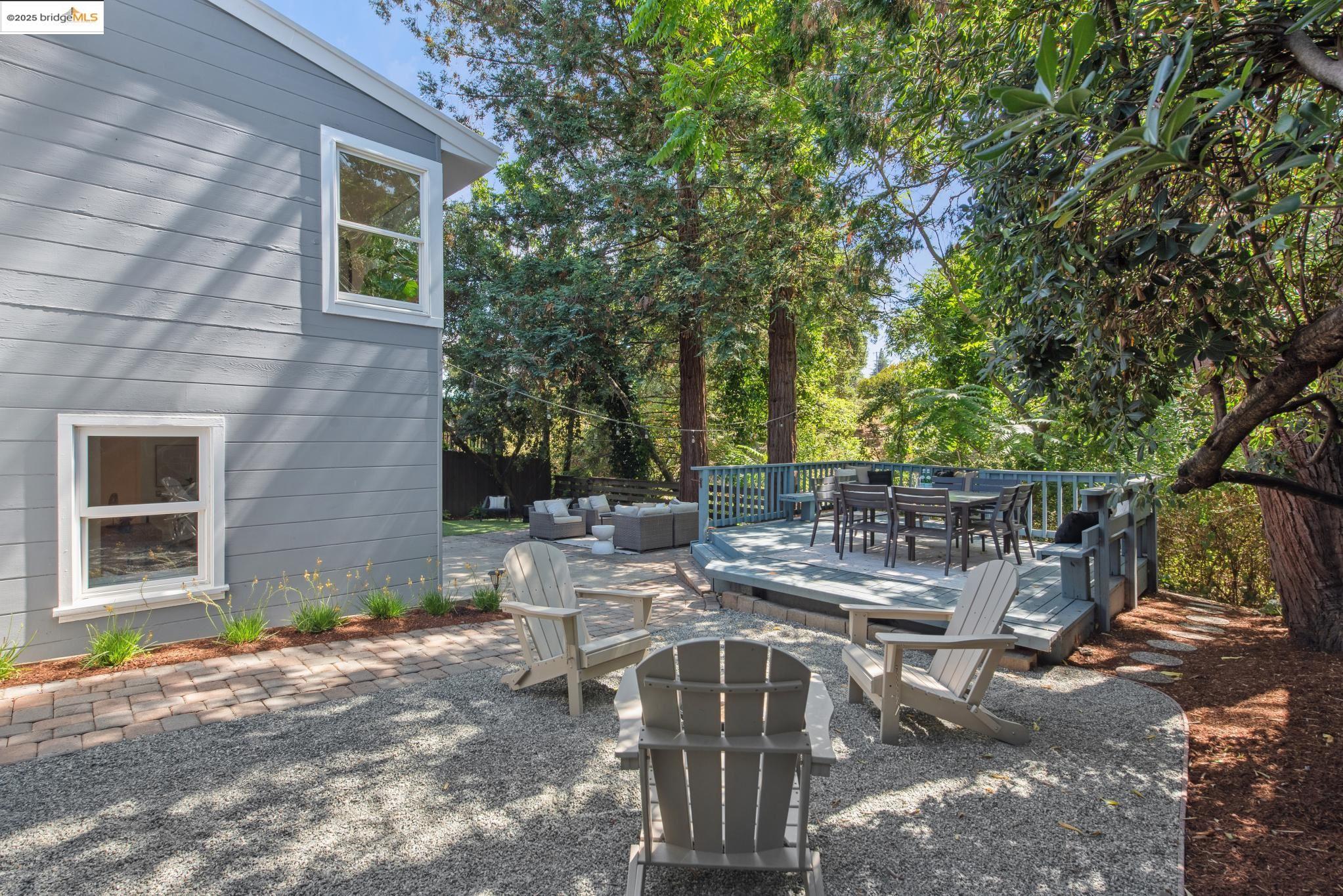 4479 Elinora Avenue Oakland, CA 94619 - Photo 42 of 47 View of patio / terrace featuring an outdoor hangout area, outdoor dining space, a deck, and view of wooded area