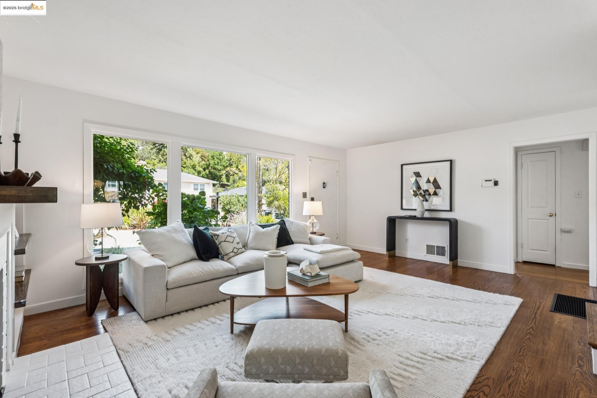4479 Elinora Avenue Oakland, CA 94619 - Photo 8 of 47 Living area with a fireplace and dark wood-type flooring