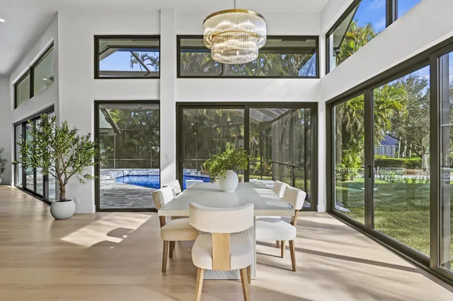 a large kitchen with a table and chairs