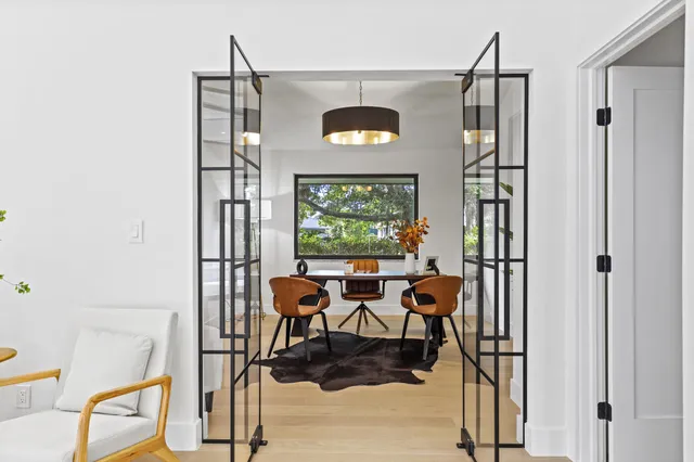 a view of a room with a potted plant and wooden floor