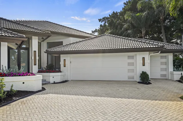 a front view of a house with a garage