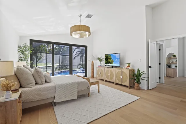 a white bath tub sitting in front of a window