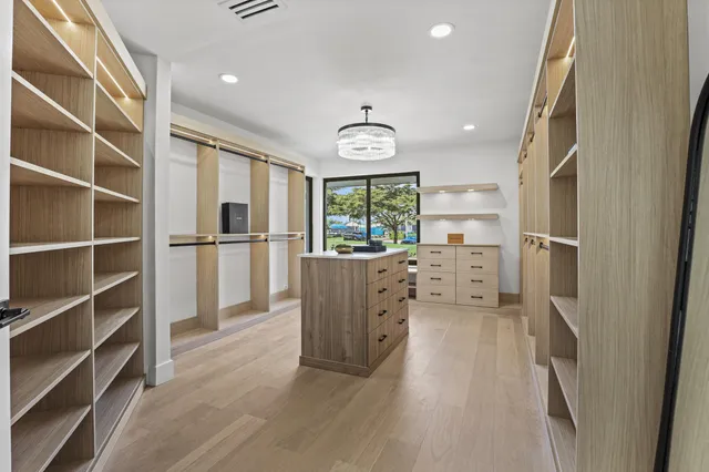 a view of a swimming pool with a yard