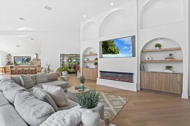 a living room with furniture and a fireplace
