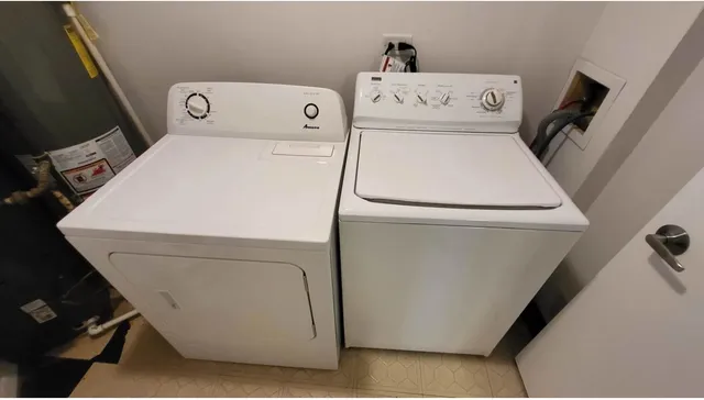 a utility room with dryer and washer