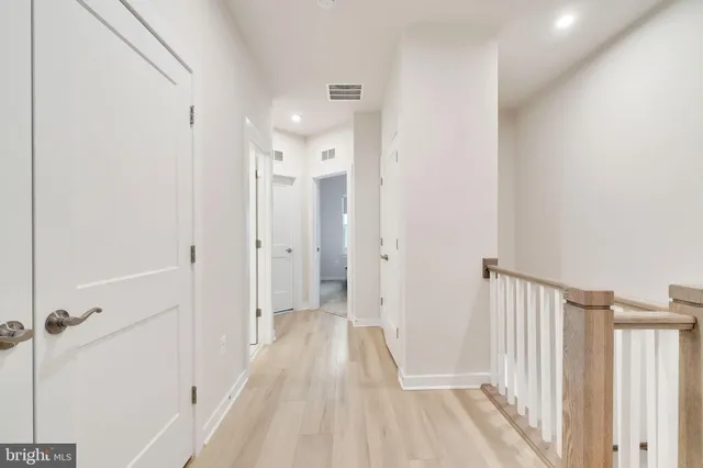 a view of a hallway with a white door