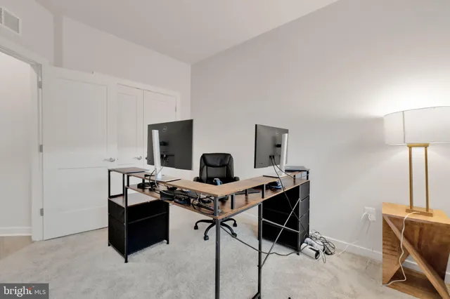 a view of a workspace with furniture