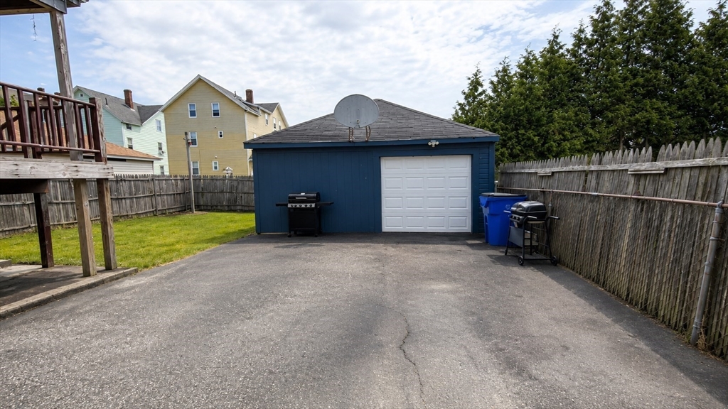 37 Shawmut Street Fall River, MA 02720 - Photo 13 of 16 a view of a house with a yard and roof