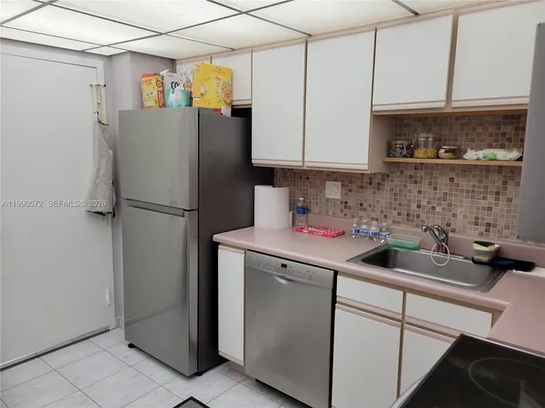 a kitchen with stainless steel appliances granite countertop a stove and a microwave