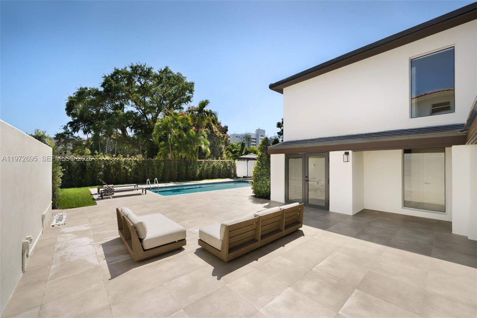 2805 Southwest 4th Avenue Miami, FL 33129 - Photo 32 of 42 a view of a patio with a table and chairs and potted plants