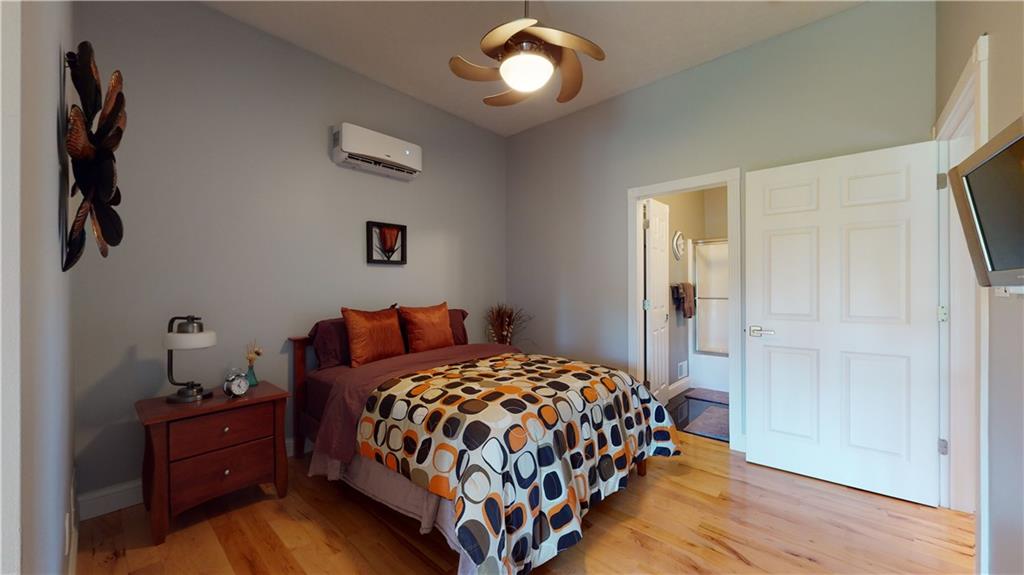 234 Reibold Road Renfrew, PA 16053 - Photo 14 of 19 a bedroom with a bed and wooden floor