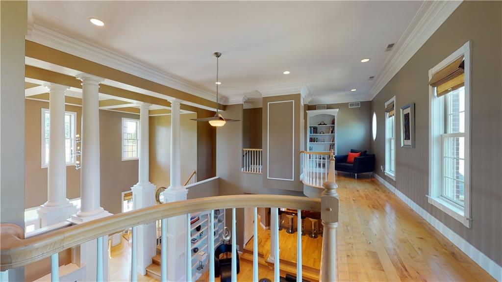 234 Reibold Road Renfrew, PA 16053 - Photo 16 of 19 a view of a hallway with wooden floor and windows