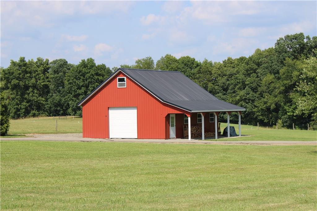 234 Reibold Road Renfrew, PA 16053 - Photo 17 of 19 a front view of a house with a yard and trees