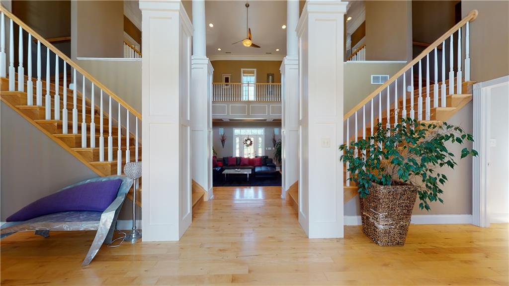 234 Reibold Road Renfrew, PA 16053 - Photo 2 of 19 a view of a hallway with wooden floor and potted plants