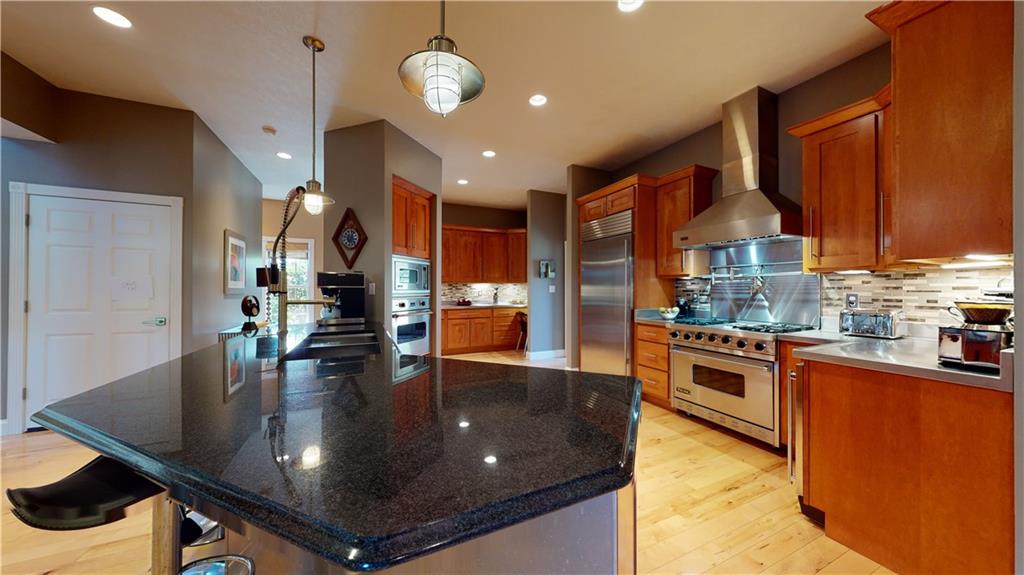 234 Reibold Road Renfrew, PA 16053 - Photo 7 of 19 a kitchen with stainless steel appliances granite countertop a sink a stove and a refrigerator