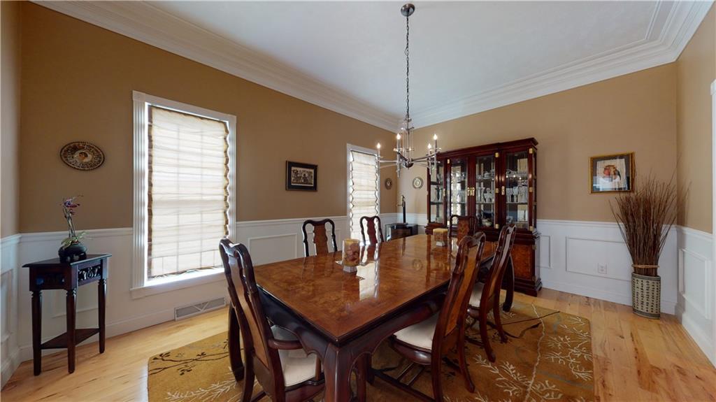 234 Reibold Road Renfrew, PA 16053 - Photo 8 of 19 a view of a dining room with furniture window and wooden floor