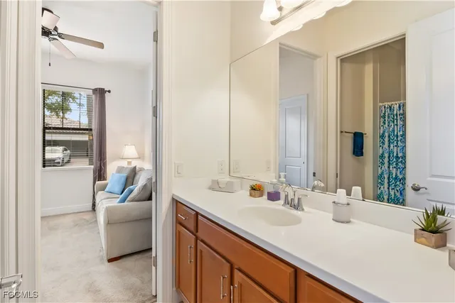 a en suite bathroom with a sink and a mirror