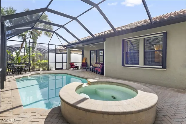 a view of a swimming pool with a patio