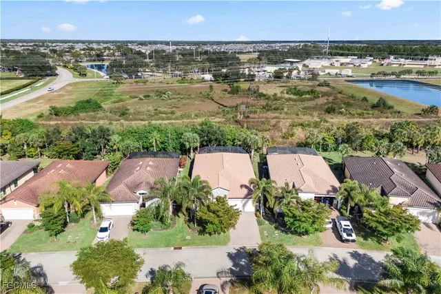 an aerial view of a house with a yard