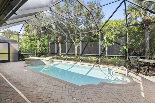 a view of a swimming pool with a patio