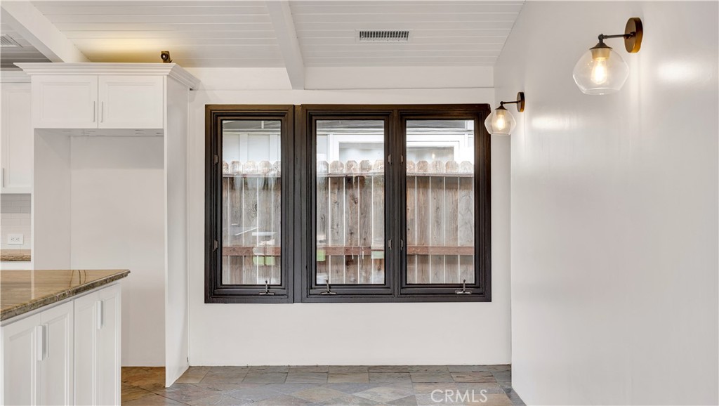 3317 Lees Avenue Long Beach, CA 90808 - Photo 16 of 75 An additional three openable windows on the north side of the home allow for maximum cross breeze when the courtyard doors are open too.