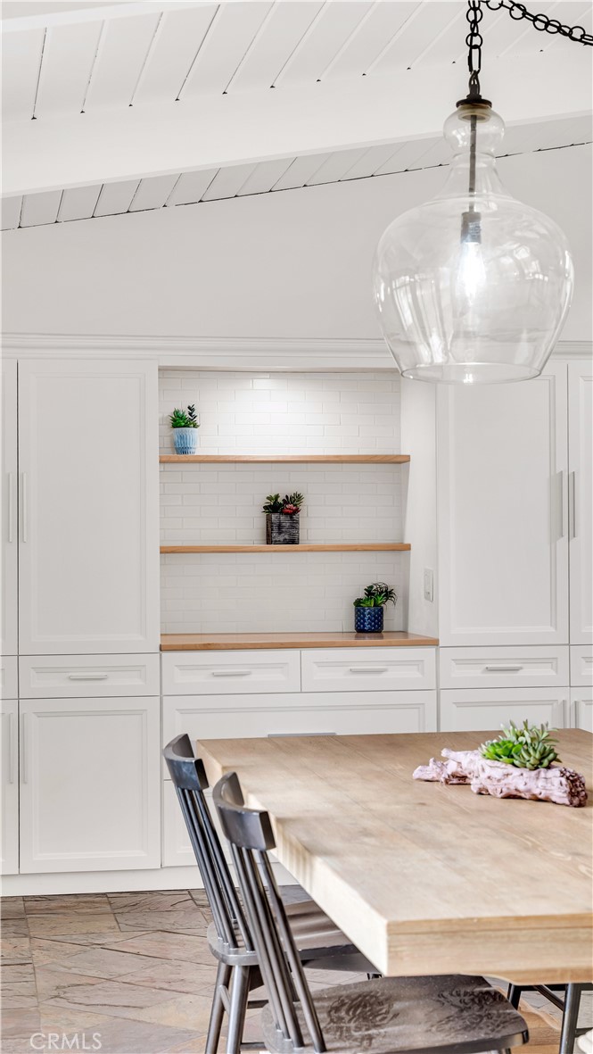 3317 Lees Avenue Long Beach, CA 90808 - Photo 19 of 75 Dining Table toward Pantry Wall with multiple pullouts and Butler Prep Area.