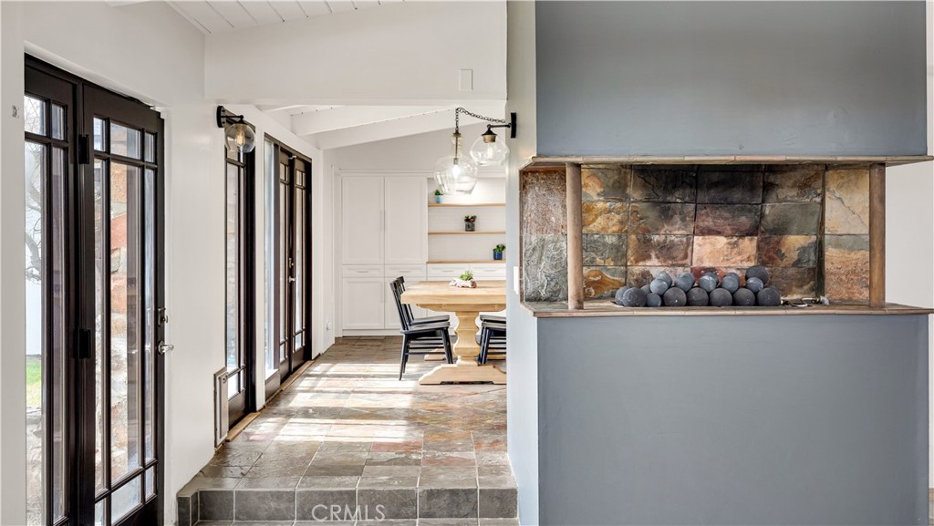 3317 Lees Avenue Long Beach, CA 90808 - Photo 20 of 75 Modern Raised Gas Fireplace with fire balls, includes the same natural slate tiles as a backdrop.