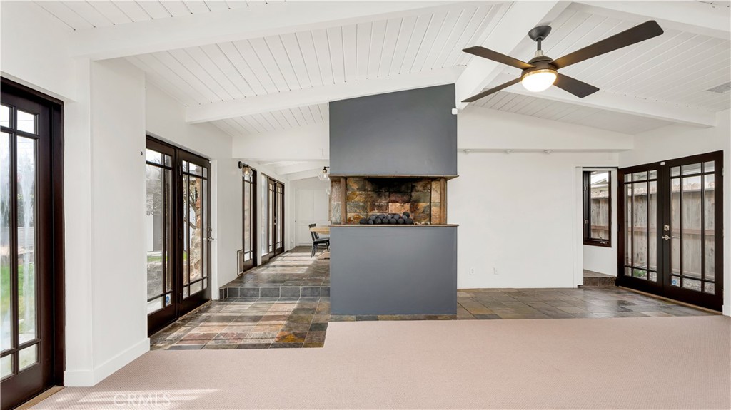 3317 Lees Avenue Long Beach, CA 90808 - Photo 21 of 75 Alluring view from Family/Living Room to show the artfully designed Cliff May style of maximum Courtyard Doors and Windows to bring the Outdoors Inside.