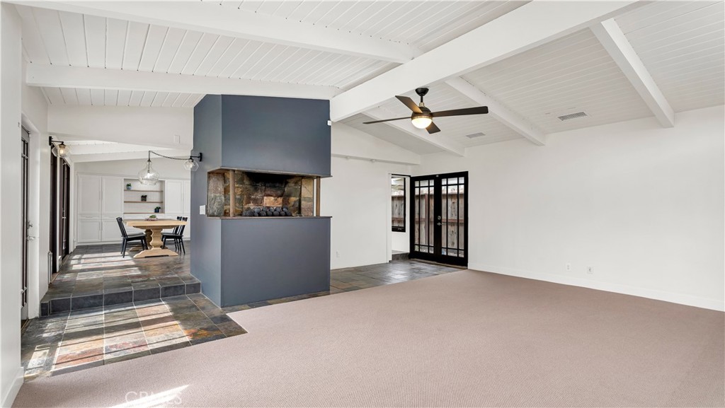 3317 Lees Avenue Long Beach, CA 90808 - Photo 24 of 75 View from Family/Living Room along the slate entrance area past the raised fireplace into the expansive Dining Area and island-Style Kitchen