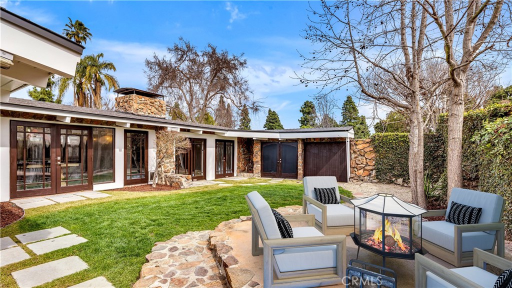 3317 Lees Avenue Long Beach, CA 90808 - Photo 3 of 75 Spacious Private Compound-like Courtyard Space with raised Patio Area and walls of lush greenery - Untold possibilities to fit your lifestyle choices (Virtually Staged)