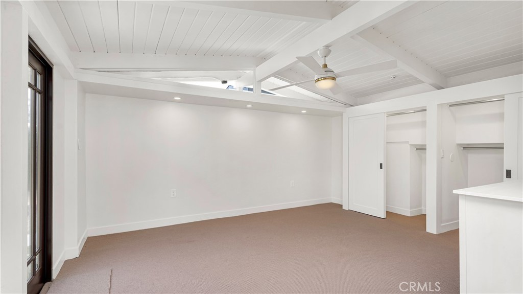3317 Lees Avenue Long Beach, CA 90808 - Photo 37 of 75 Primary en Suite Bedroom with dual lighted closets and new carpeting throughout and clerestory windows with beamed ceilings