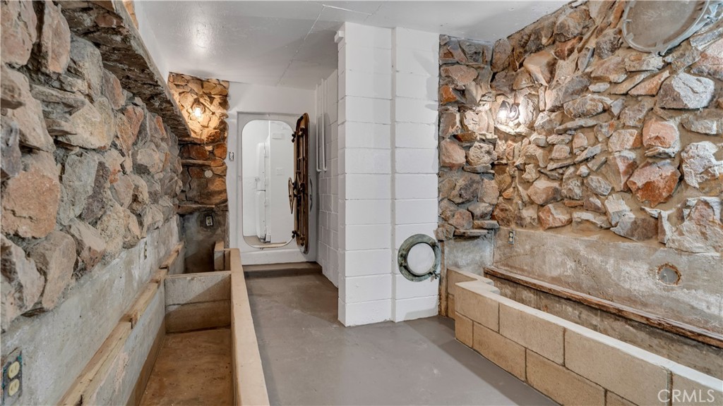 3317 Lees Avenue Long Beach, CA 90808 - Photo 55 of 75 View toward the steel protective door and entry alcove area. This Fully Lighted Underground Bunker/Shelter space complete with multiple storage areas that used to have solid covers that served as Sleeping Positions. Electricity is fully functional