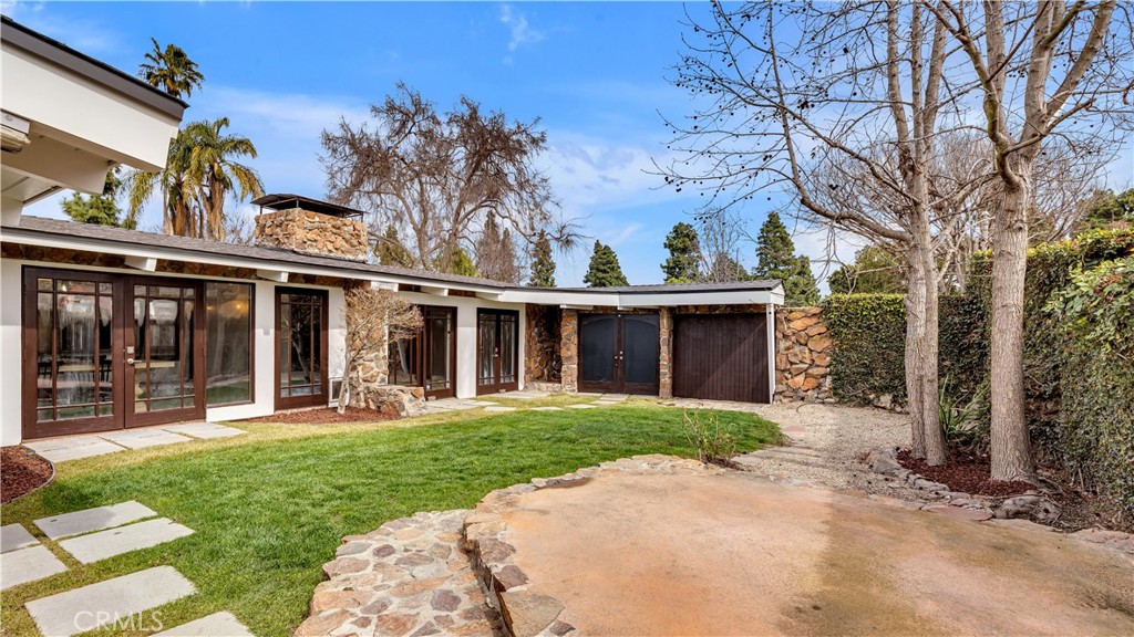 3317 Lees Avenue Long Beach, CA 90808 - Photo 64 of 75 Untold possibilities abound with the private courtyard area, and it's mix of pea rock, patio and grass.
