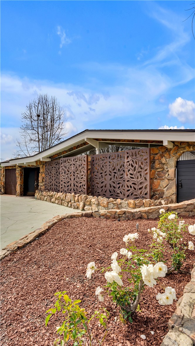3317 Lees Avenue Long Beach, CA 90808 - Photo 70 of 75 Stylish and modern curb appeal with heavy natural granite stone facade that requires very little maintenance and artful decorative panels that soften the exterior and create a warm welcoming feel