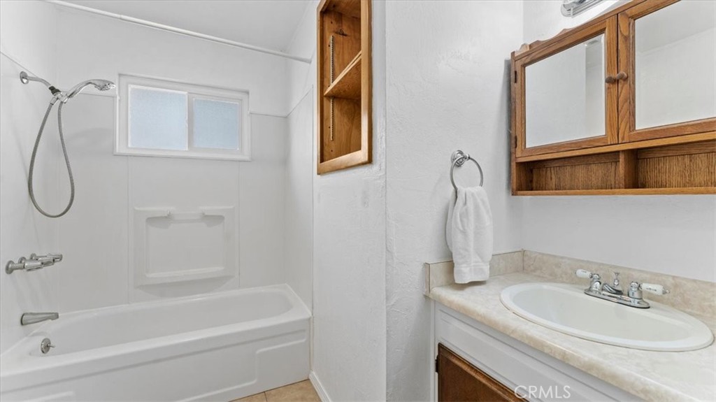 112 Los Verjeles Road Bangor, CA 95901 - Photo 38 of 48 a bathroom with a sink vanity tub and a mirror