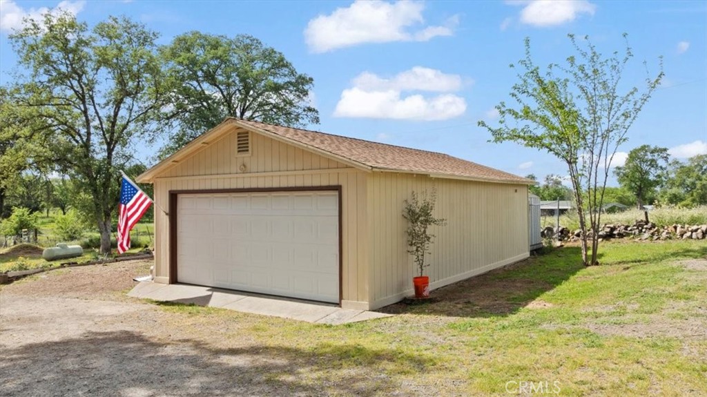 112 Los Verjeles Road Bangor, CA 95901 - Photo 5 of 48 a front view of a house with a yard and garage