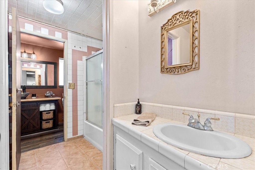222 Village Square Fillmore, CA 93015 - Photo 20 of 39 a en suite bathroom with a sink double vanity and a mirror