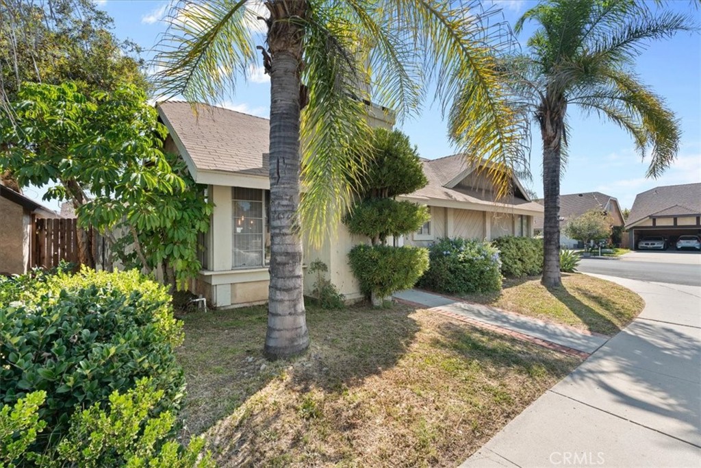 222 Village Square Fillmore, CA 93015 - Photo 2 of 39 a view of a house with a yard and palm trees