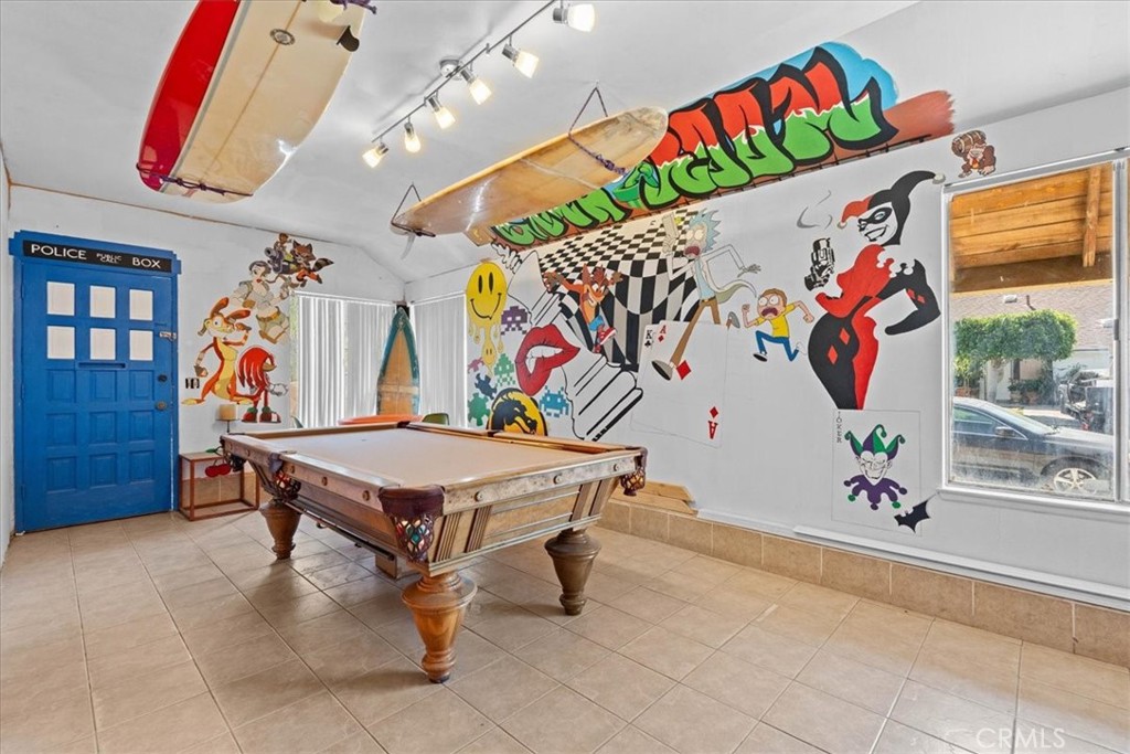 222 Village Square Fillmore, CA 93015 - Photo 24 of 39 a room with a table tennis air hockey table and arcade game machine