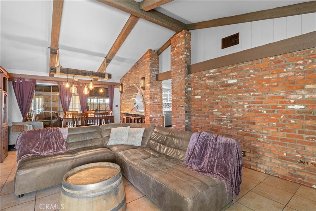 222 Village Square Fillmore, CA 93015 - Photo 6 of 39 a living room with furniture and a floor to ceiling window