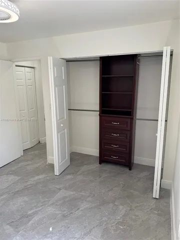a view of an empty walk in closet
