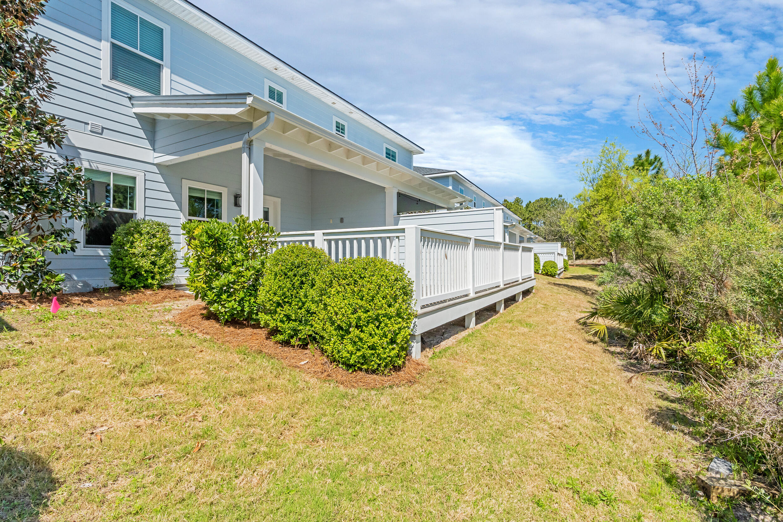 25 Golden Bell Ct Inlet Beach, Unit 25B Inlet Beach, FL 32461 - Photo 4 of 48 front view of a house with a yard