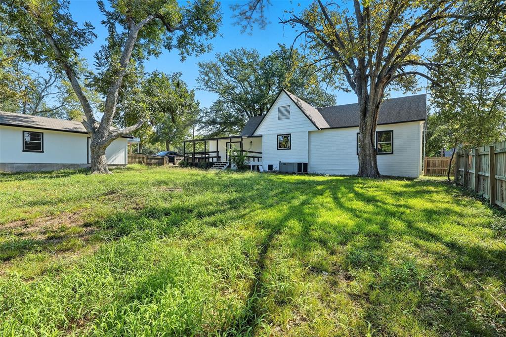 605 North Main Street Winnsboro, TX 75494 - Photo 11 of 29 a view of a house with a yard