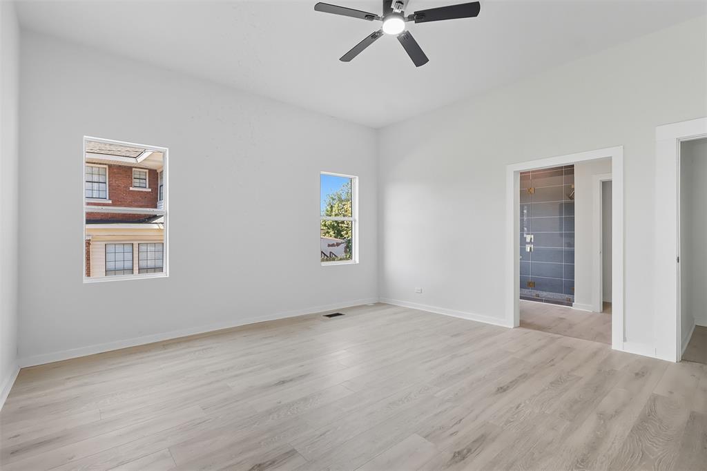 605 North Main Street Winnsboro, TX 75494 - Photo 13 of 29 a view of empty room with wooden floor and fan