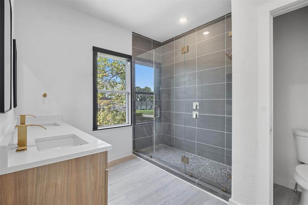 605 North Main Street Winnsboro, TX 75494 - Photo 14 of 29 a bathroom with a shower and a sink