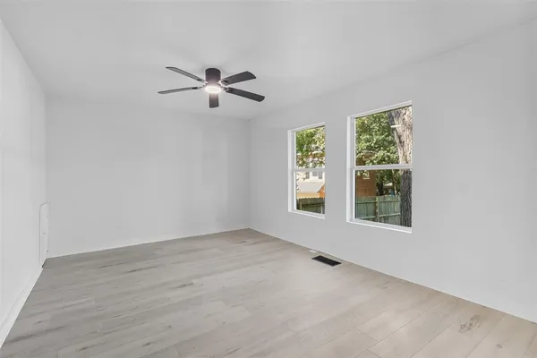 a kitchen with cabinets a sink and appliances
