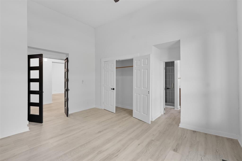 605 North Main Street Winnsboro, TX 75494 - Photo 22 of 29 a view of an empty room with wooden floor and closet