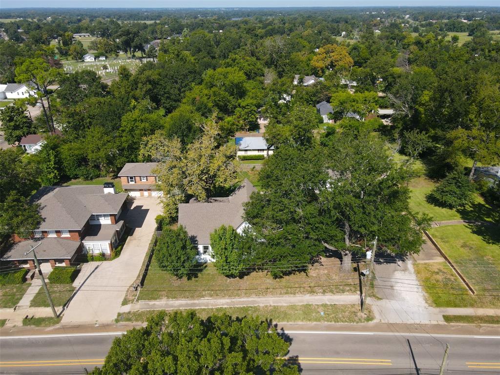 605 North Main Street Winnsboro, TX 75494 - Photo 29 of 29 an aerial view of residential houses with outdoor space and trees