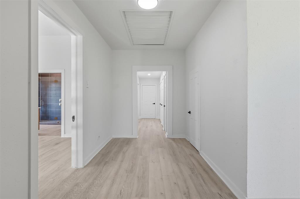 605 North Main Street Winnsboro, TX 75494 - Photo 7 of 29 a view of a hallway with wooden floor